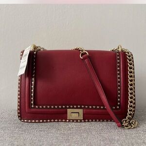 INC International Concepts Red Crossbody Bag with Gold Accents with price tag.